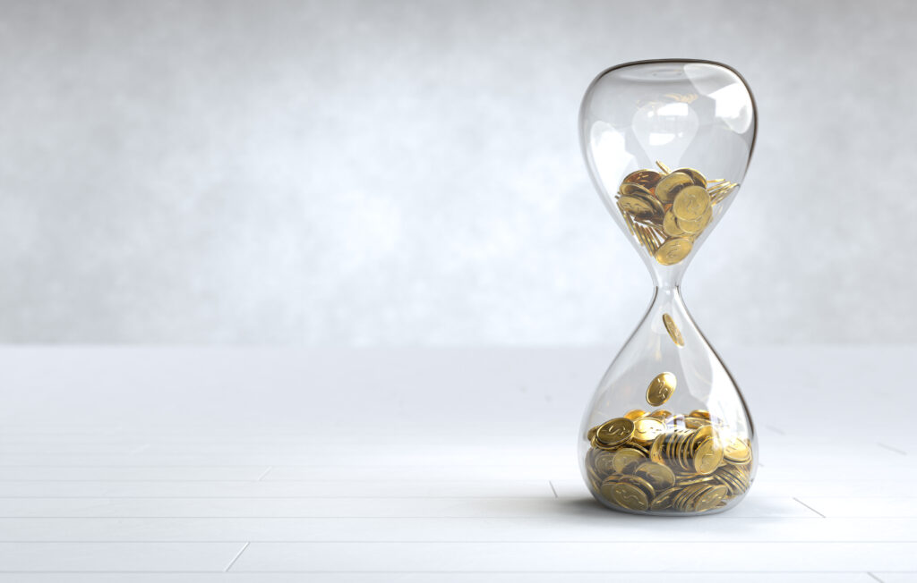 Investment Plan 1 gold coin hourglass time is money concept