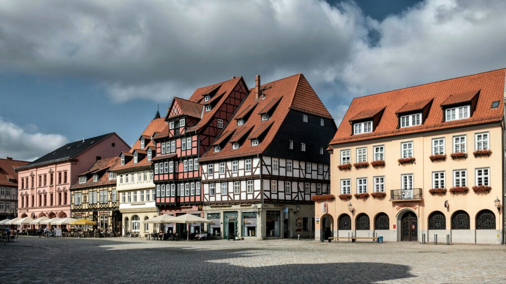 Real Estate Charming historic half-thimbered buildings in town square. Represents old real estate.