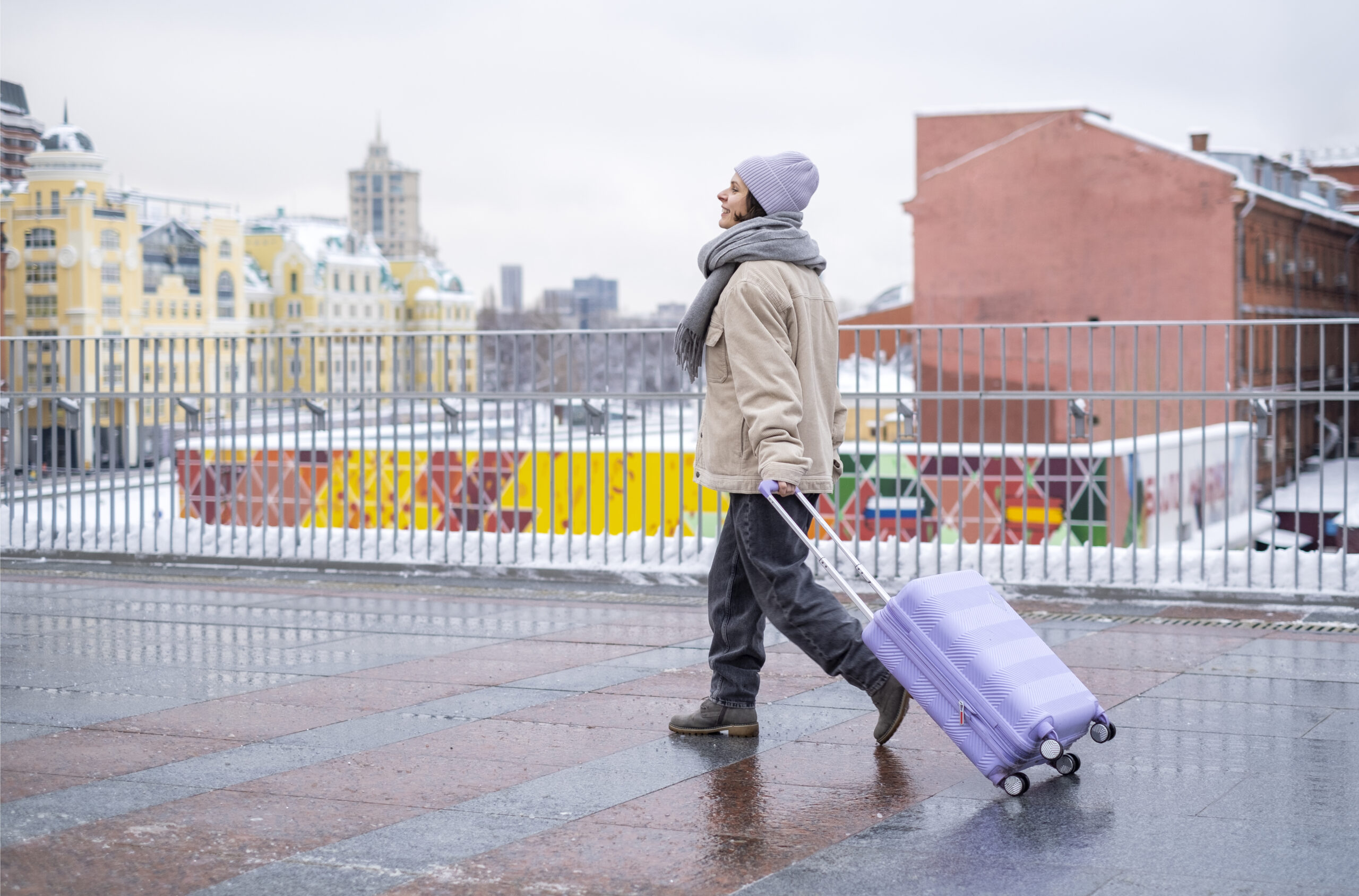 Blog woman with luggage walking on a street, moving to Germany