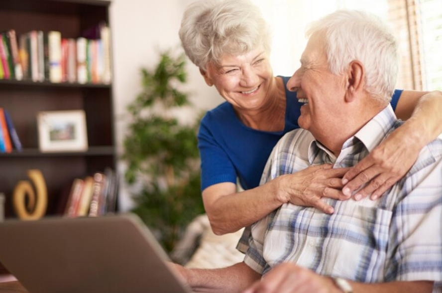 Happy couple of retiree in the living room